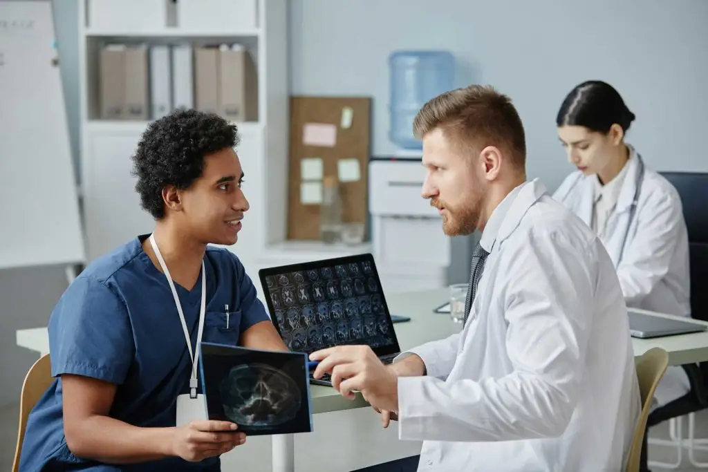 two-male-doctors-discussing-x-ray-images-working-i-2023-11-27-04-54-56-utc.jpg